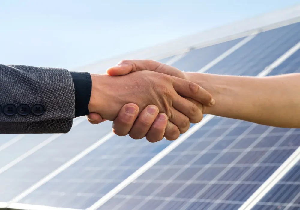 neos-esco-partnership-solar-handshake.webp ESCO contracting partnership at solar farm – investment repaid from energy savings